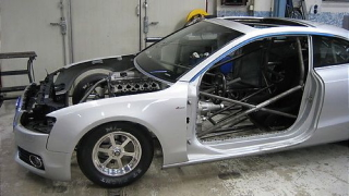 Illustration for article titled Watch an Audi A5 transform into a drag car